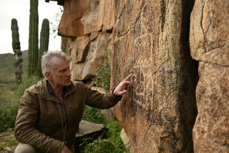 Scott Wolter Examining Petroglyphs